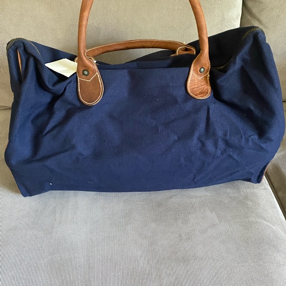 Warner Brothers, canvas, cotton duffel with leather straps, and trim. - Picture 3 of 7